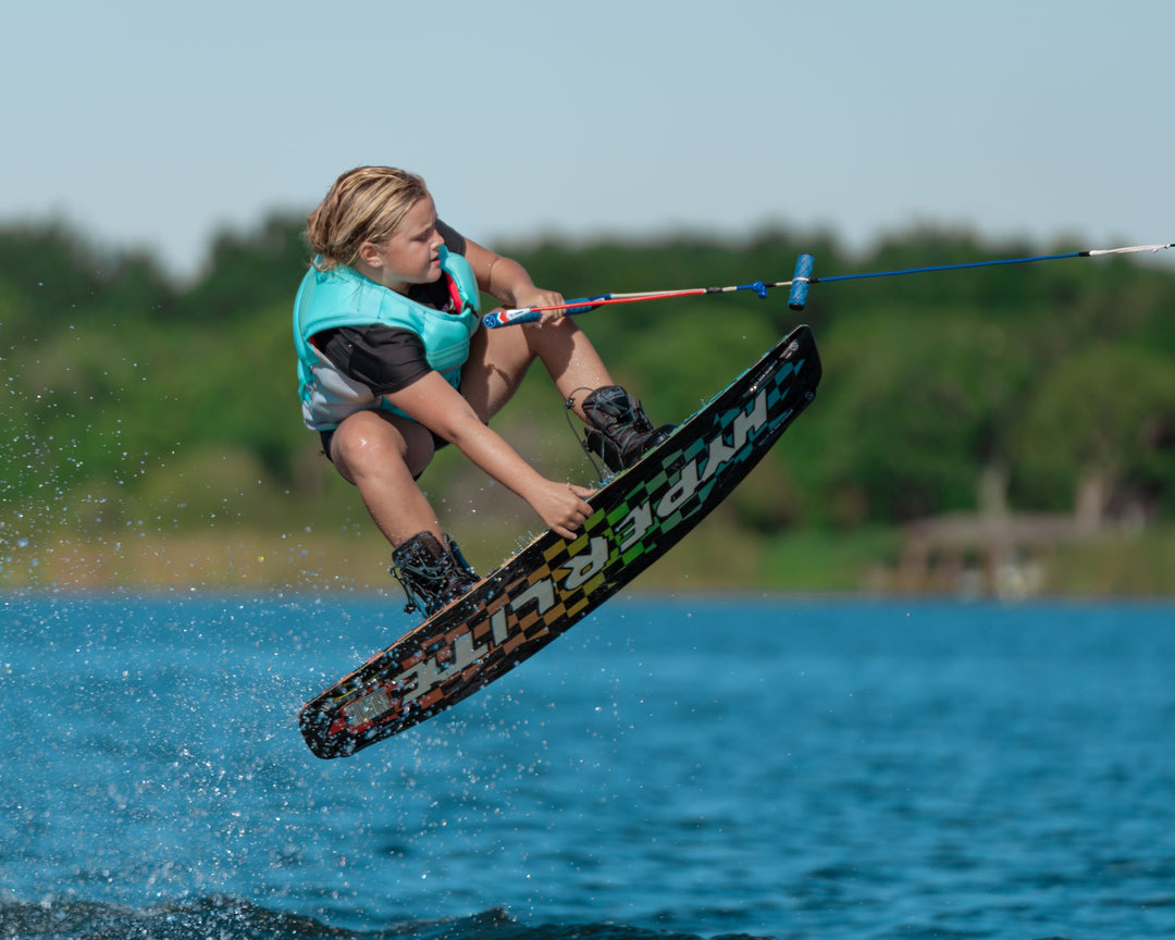 A young rider wearing our Jetpilot Youth Murray CGA Vest in the color Sky.