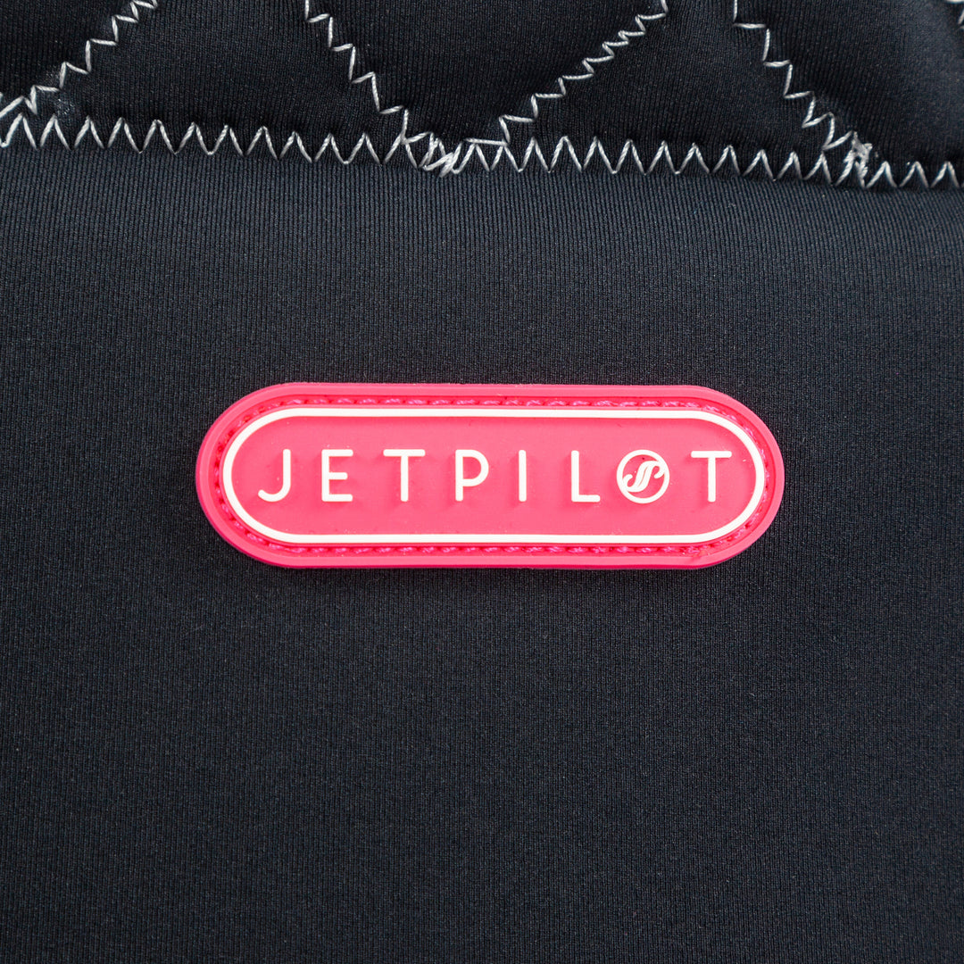 Closeup view showing the logo of the Wave Farer Comp vest black colorway. #color_black