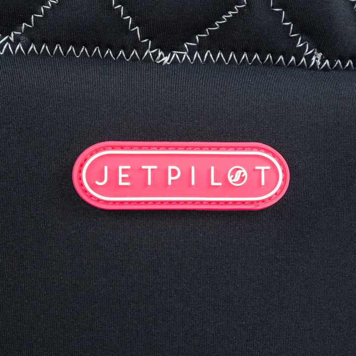 Closeup view showing the logo of the Wave Farer Comp vest black colorway. #color_black