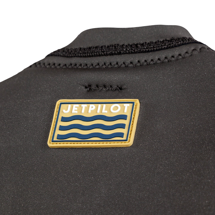 Closeup view of the Jetpilot Freeboard Ayala Comp Vest logo. #color_ayala-black