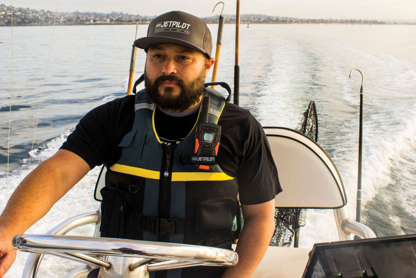Boat driver wearing the Jetpilot L.R.E. Helmsman life vest.