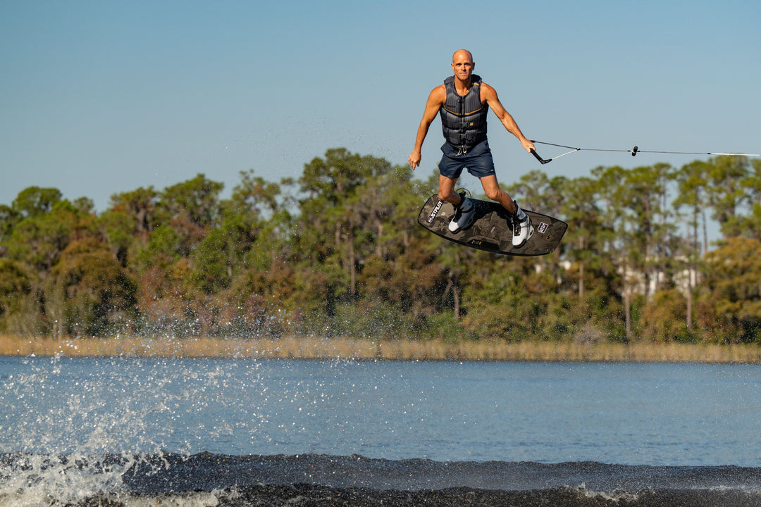 Shaun Murray wakeboarding in the new 2026 Jetpilot Murray vest. #color_gray
