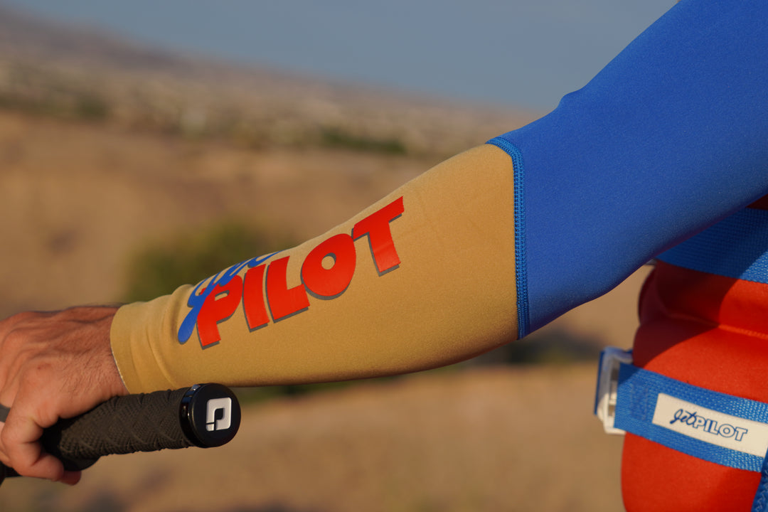 Mark Gomez in the red and blue Vintage Class racing suit . #color_red-blue