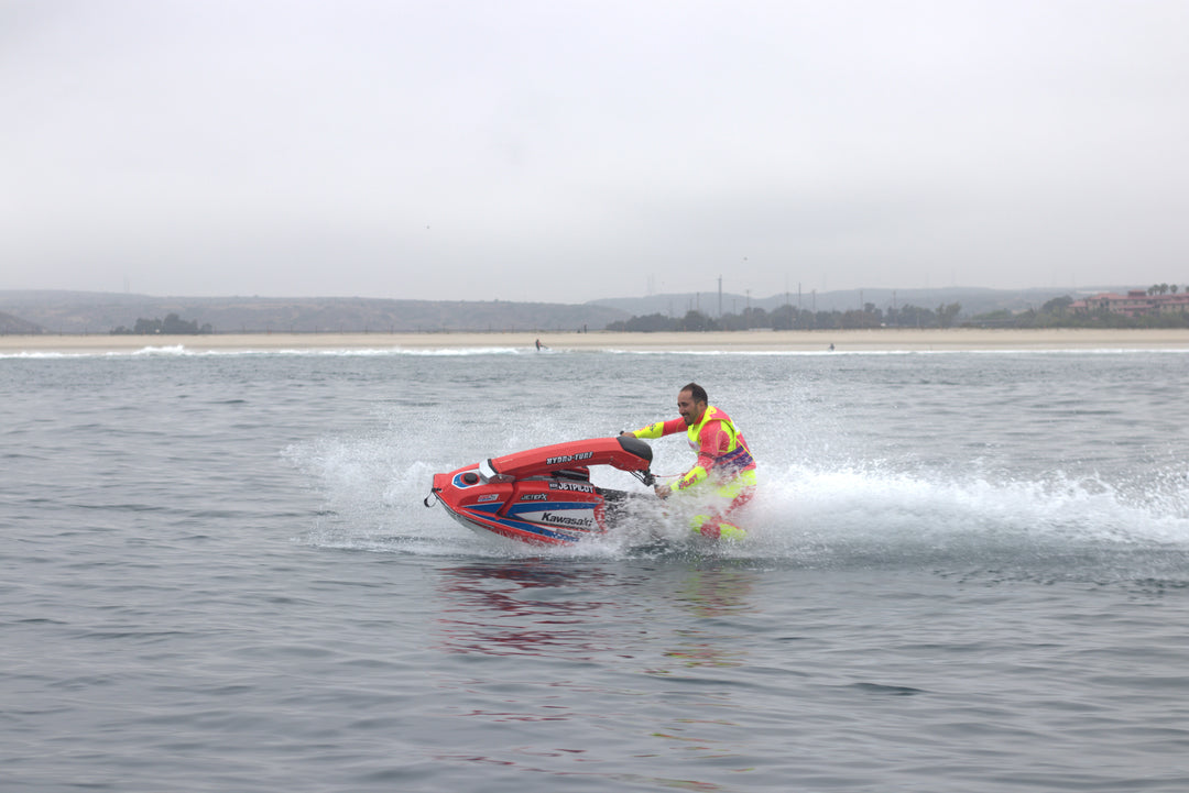 Jetpilot team rider Mark Gomez wearing the Vintage Class Racer John. #color_neon-pink
