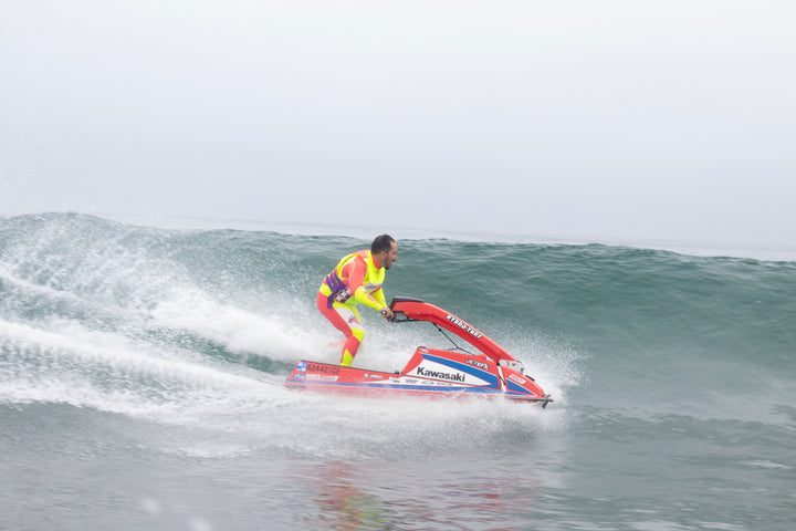 Jetpilot team rider Mark Gomez wearing the Vintage Class Racer John. #color_neon-pink