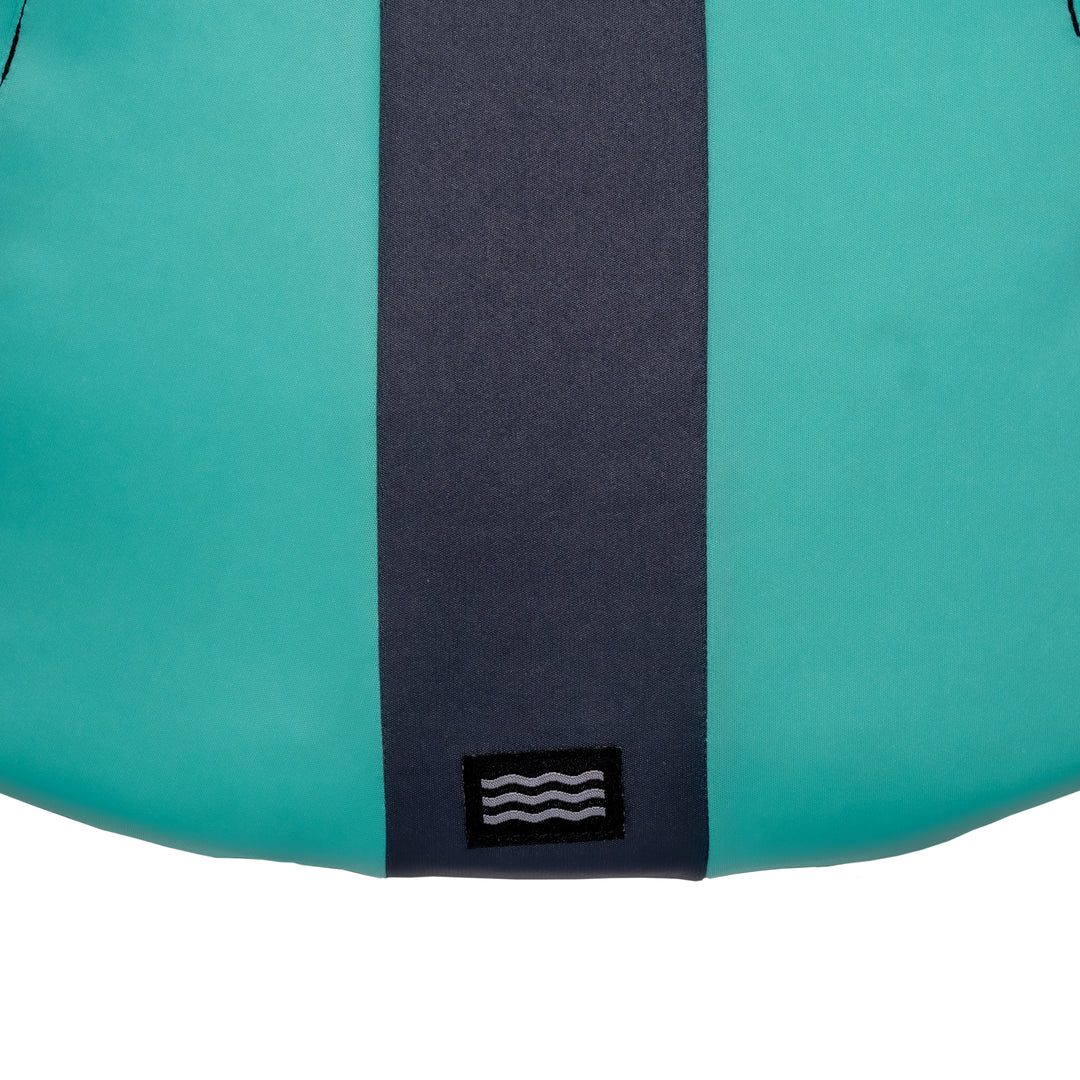 View of the Jetpilot Women's Cause CGA Vest lower back logo. #color_teal