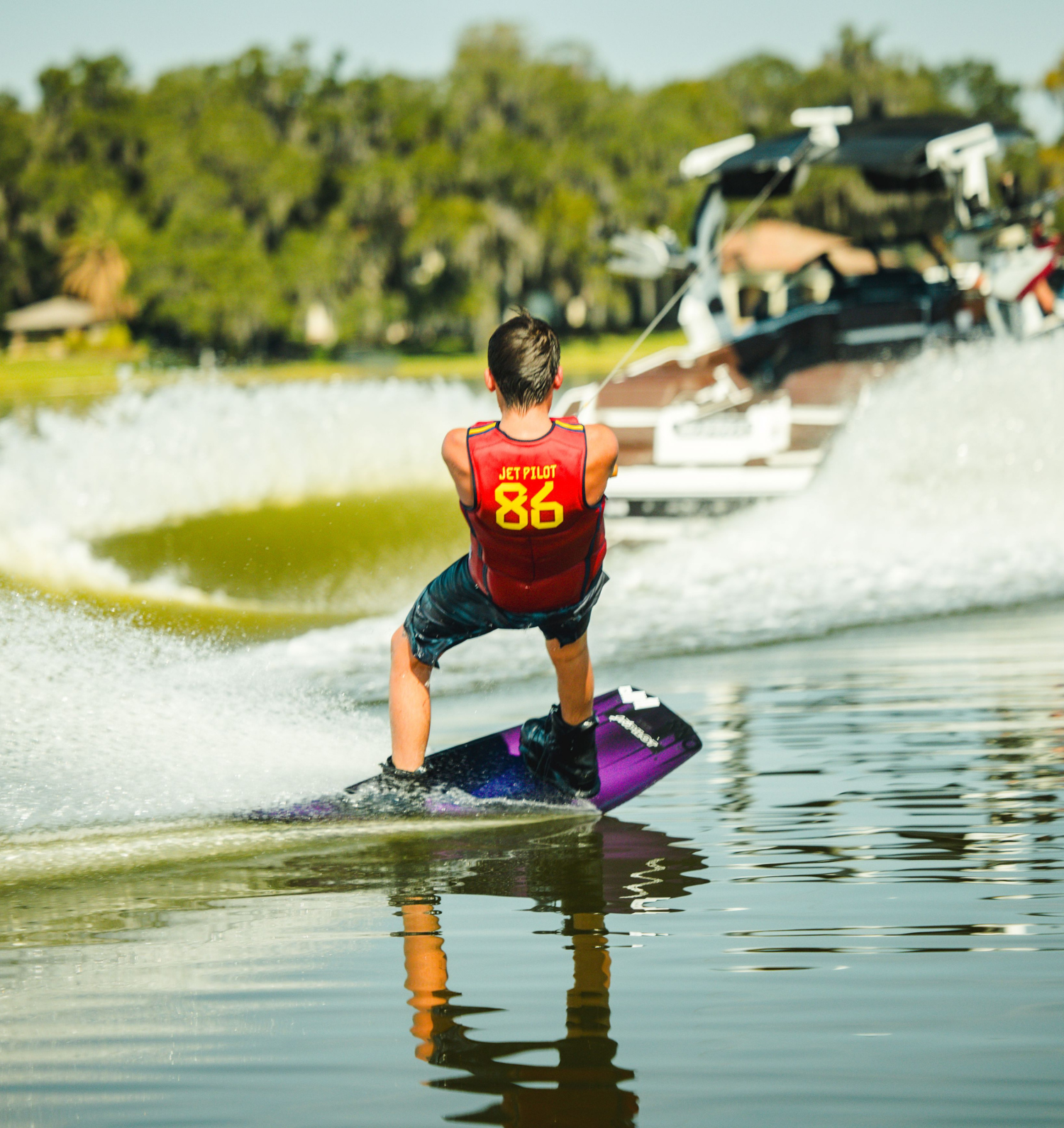Jetpilot team rider wakeboarding in the Baller Comp vest.