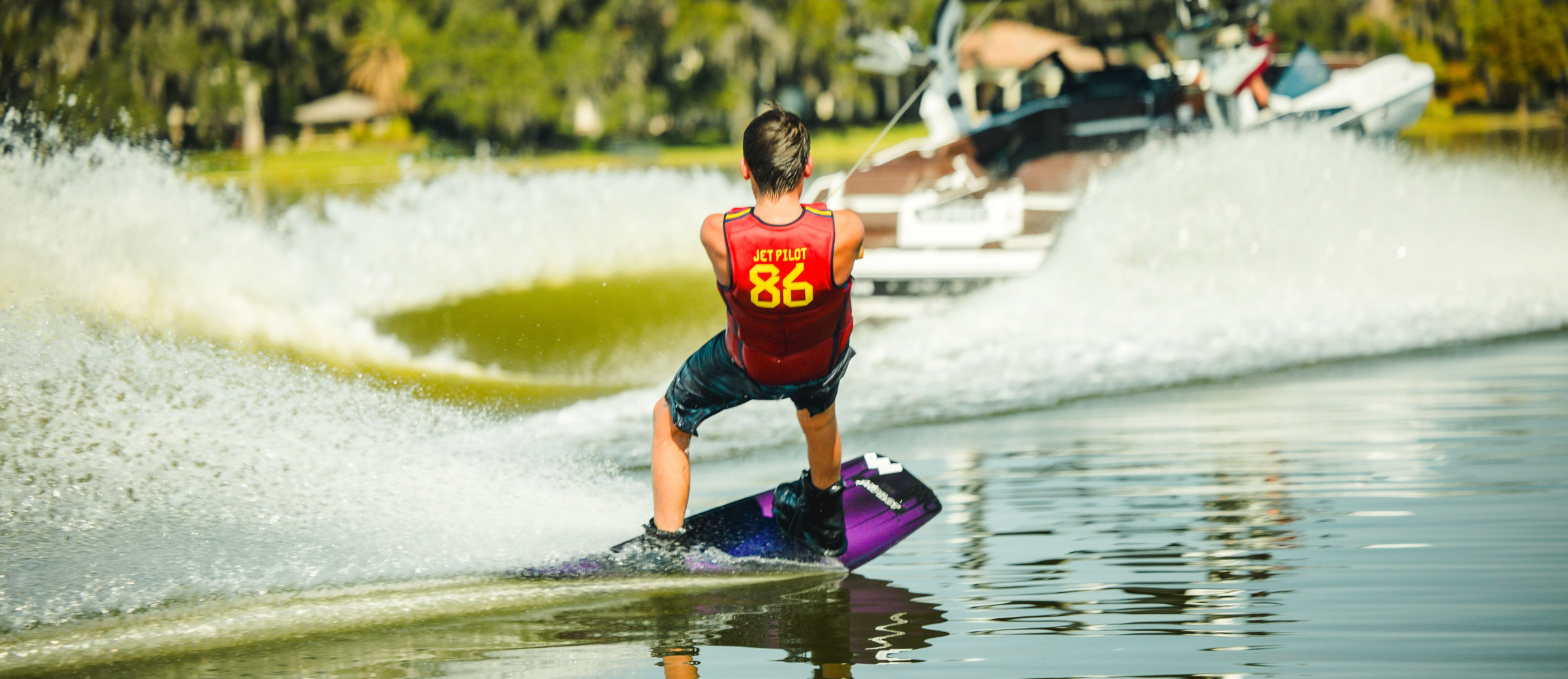 Jetpilot team rider wakeboarding in the Baller Comp vest.