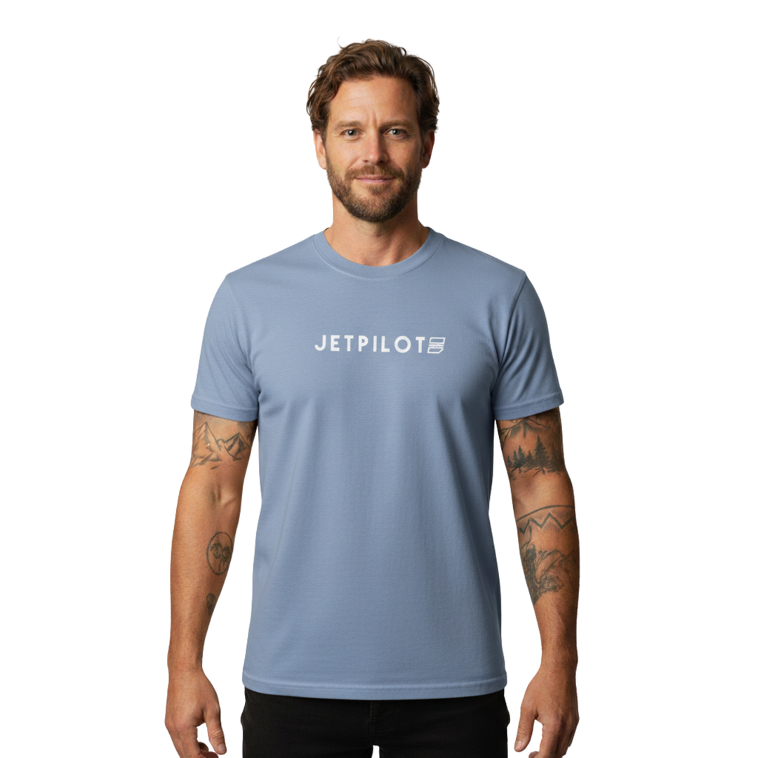 Man wearing a blue Jetpilot t-shirt with the Jetpilot logo in the middle