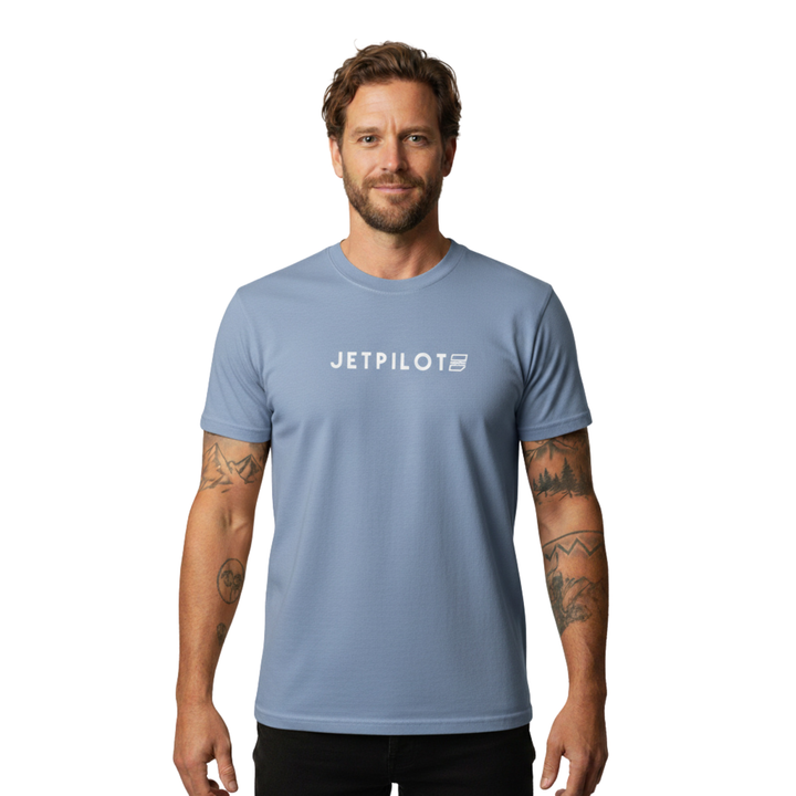 Man wearing a blue Jetpilot t-shirt with the Jetpilot logo in the middle