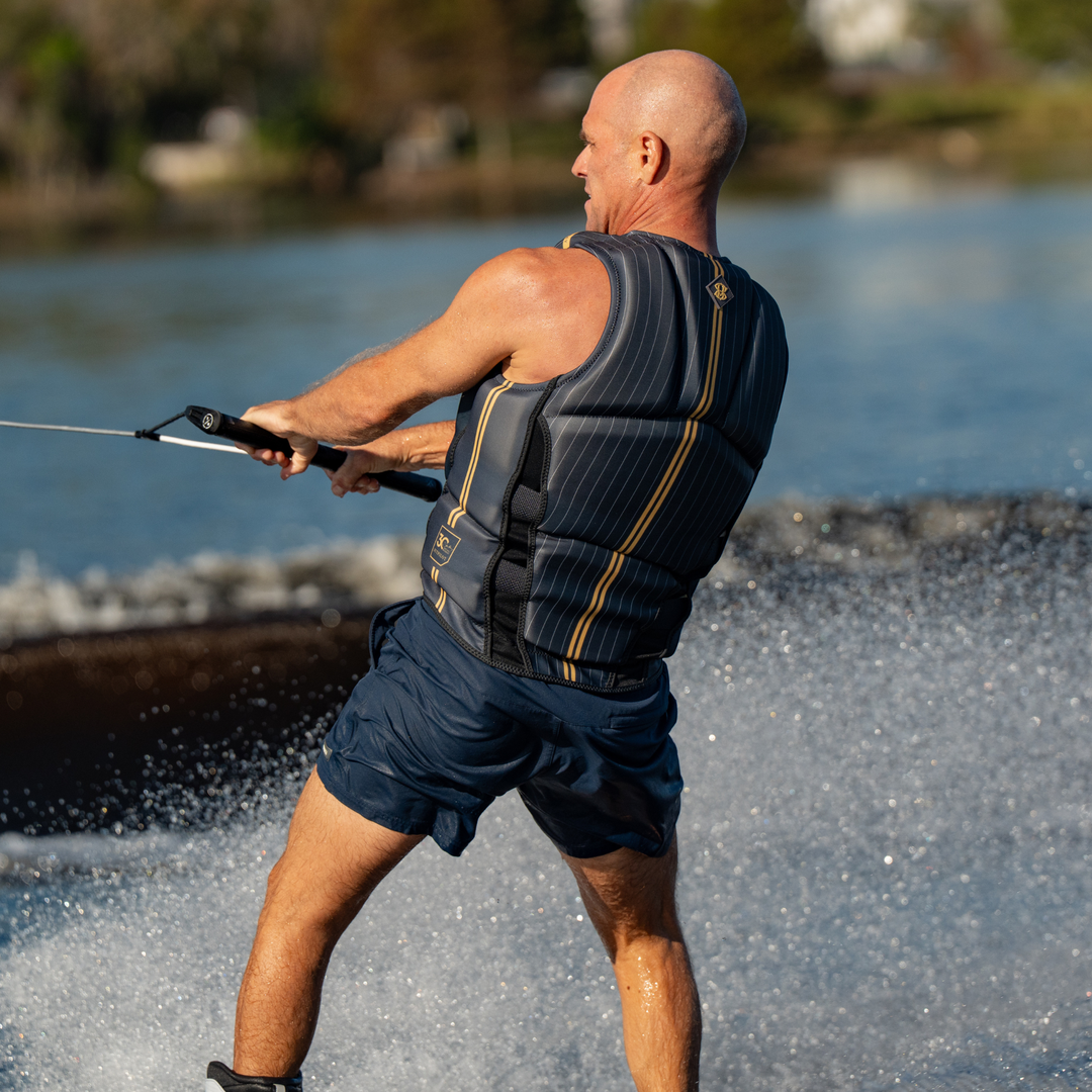 Man wakeboarding on a lake with a blurred background. #color_gray