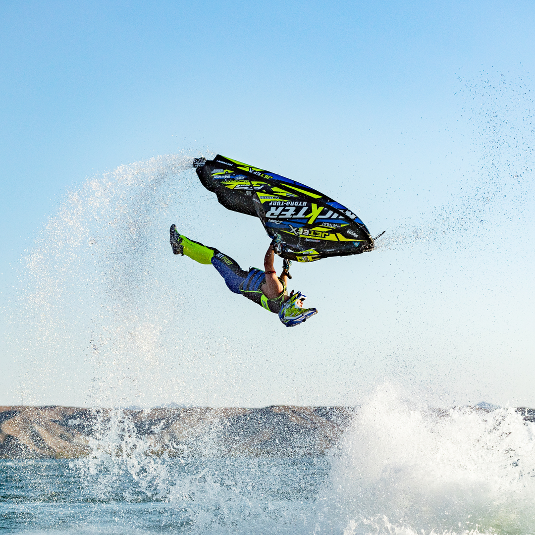 Front view of Jetpilot's team rider Mark Gomez doing a back flip.