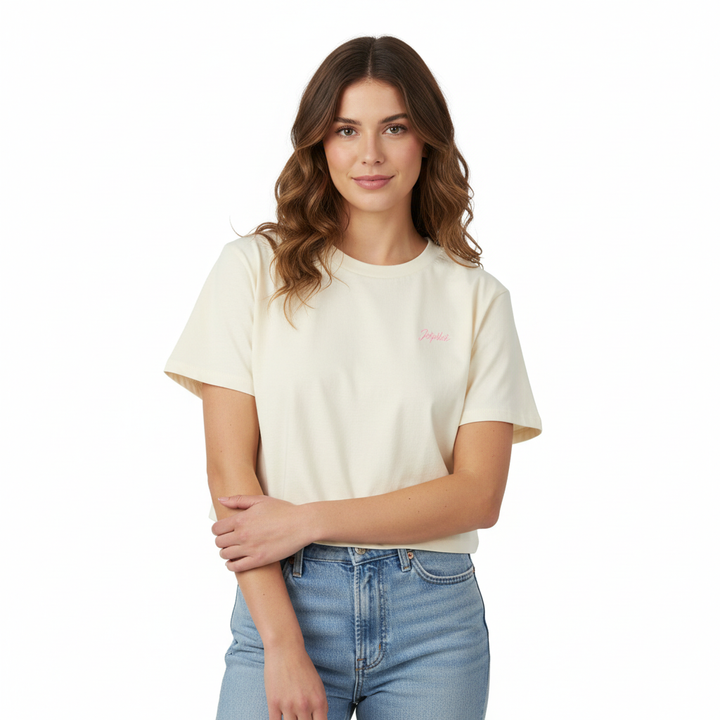 Women wearing a beige t-shirt with a small Jetpilot logo