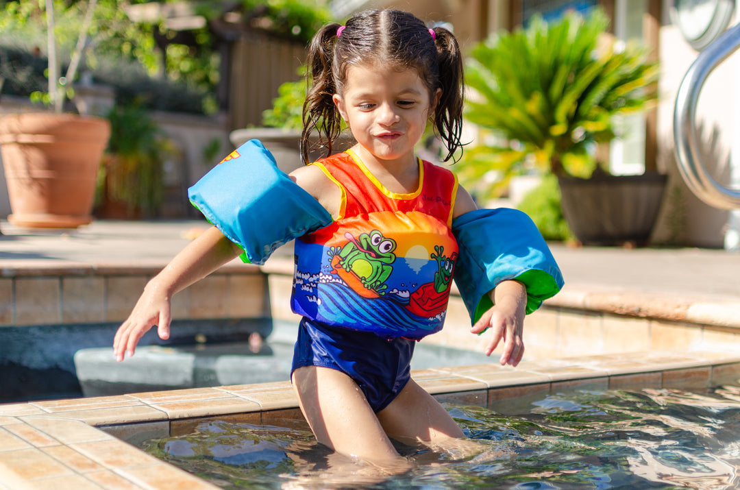 Image of a girl wearing the Jetpilot Lil Wing Man swim vest.