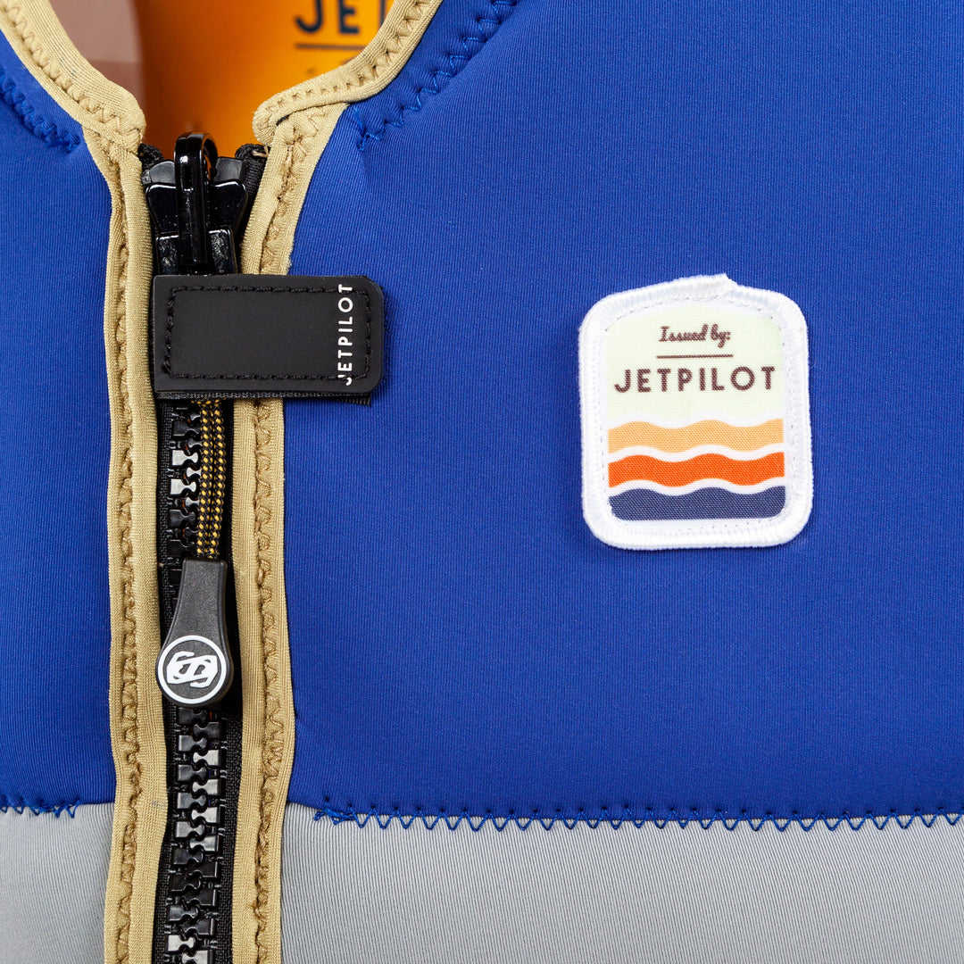Closeup of the Jetpilot Draftline Comp Vest zipper. #color_navy-gold