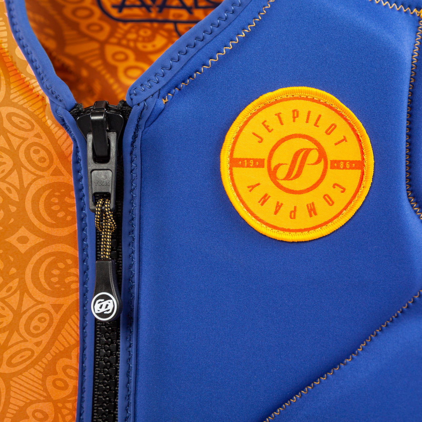 Closeup view of the Jetpilot Women's Avalon Comp Vest logo. #color_steel-blue